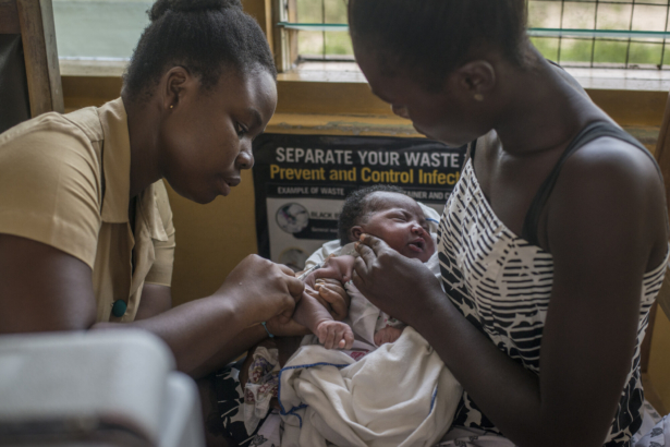 A nurse administers a vaccine to a child at Ewin Polyclinic in Cape Coast on April 30, 2019. (Cristina Aldehuela/AFP via Getty Images)