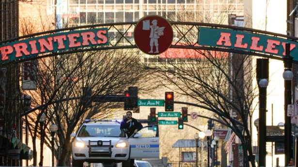 A police officer blocks a street as the investigation continues into an explosion in Nashville, Tenn., on Dec. 26, 2020. (Mark Humphrey/AP Photo)