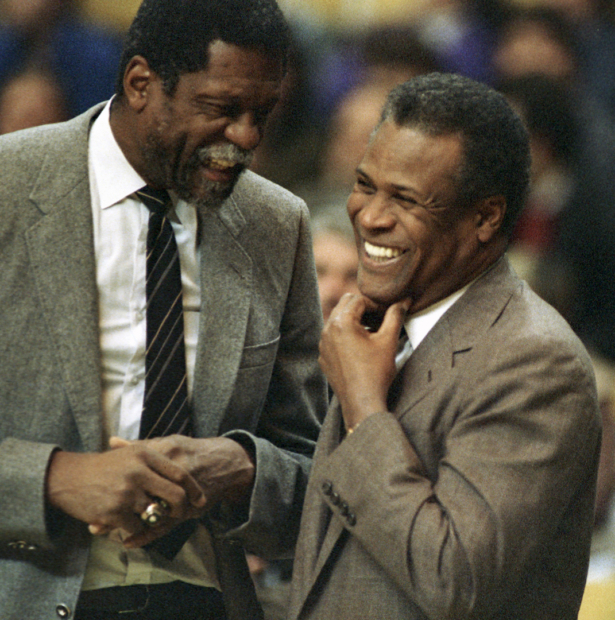 Former Boston Celtics teammates Bill Russell, Sacramento Kings coach, left, and K.C. Jones, Celtics coach, meet before the start of the Kings-Celtics NBA basketball game at the Boston Garden in Boston on Jan. 15, 1988. (Mike Kullen, File/AP)