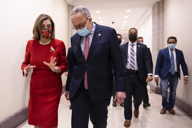 Speaker of the House Nancy Pelosi (D-CA) and Senate Minority Leader Chuck Schumer (D-NY) speak after a press conference on Capitol Hill in Washington on Dec. 20, 2020. (Tasos Katopodis/Getty Images)