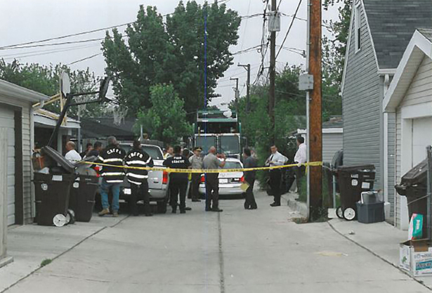 Police investigating the area where the bodies of twin newborn boys were discovered in Stickney Township, Ill., in June 2003. (Courtesy of Cook County Sheriff's Office)
