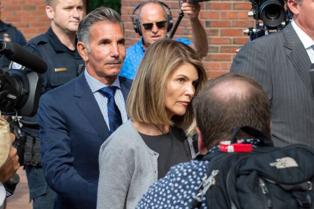 Actress Lori Loughlin and husband Mossimo Giannulli exit the Boston Federal Court house after a pre-trial hearing with Magistrate Judge Kelley at the John Joseph Moakley U.S. Courthouse in Boston on Aug. 27, 2019. (Joseph Prezioso/AFP via Getty Images)