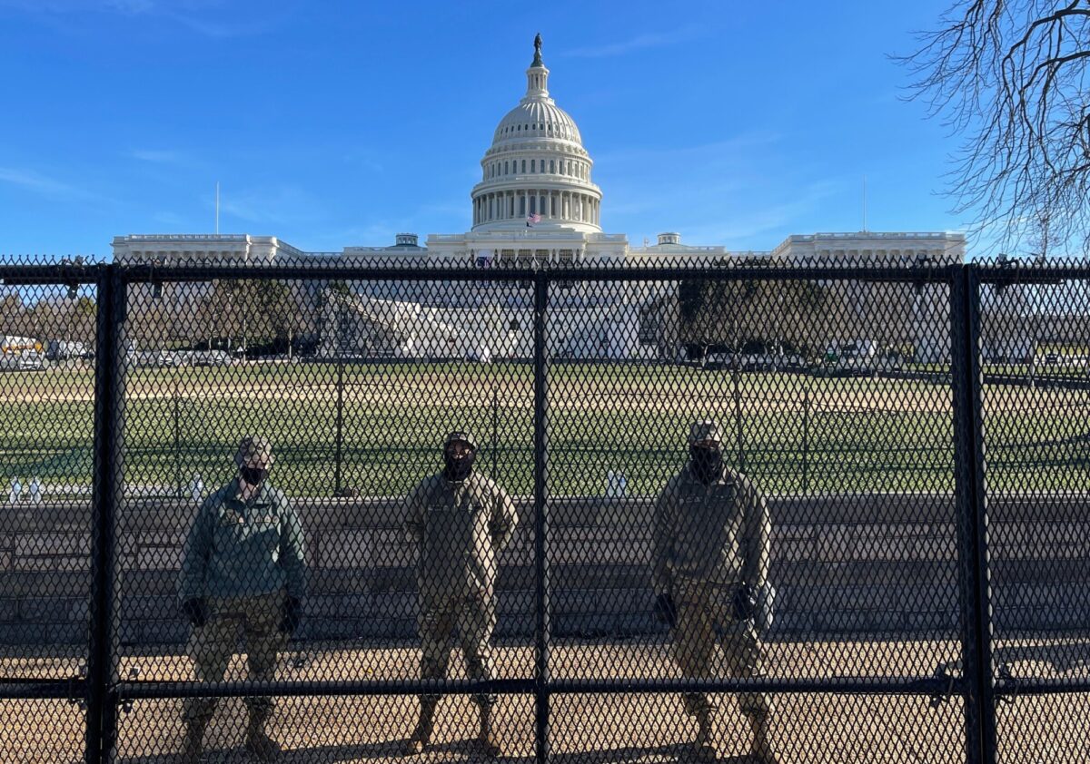 National Guard soldiers guard the grounds of the U.S. Capitol from behind a security fence in Washington, on Jan. 9, 2021. (Daniel Slim/AFP via Getty Images)