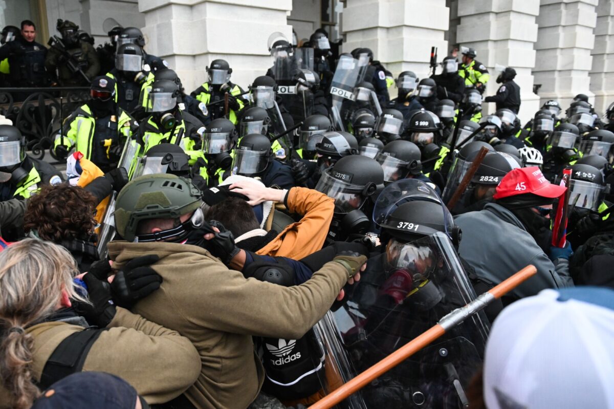 Protesters clash with police officers outside U.S. Capitol building in Washington, on Jan. 6, 2021. (Roberto Schmidt/AFP via Getty Images)