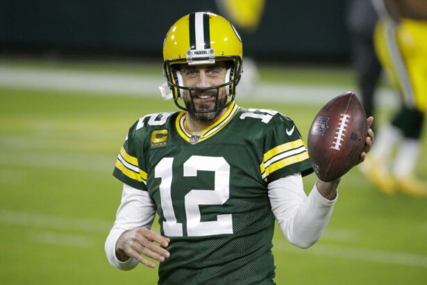 Green Bay Packers' Aaron Rodgers warms up before an NFL football game in Green Bay, Wis., on Nov. 29, 2020. (Mike Roemer/AP Photo)