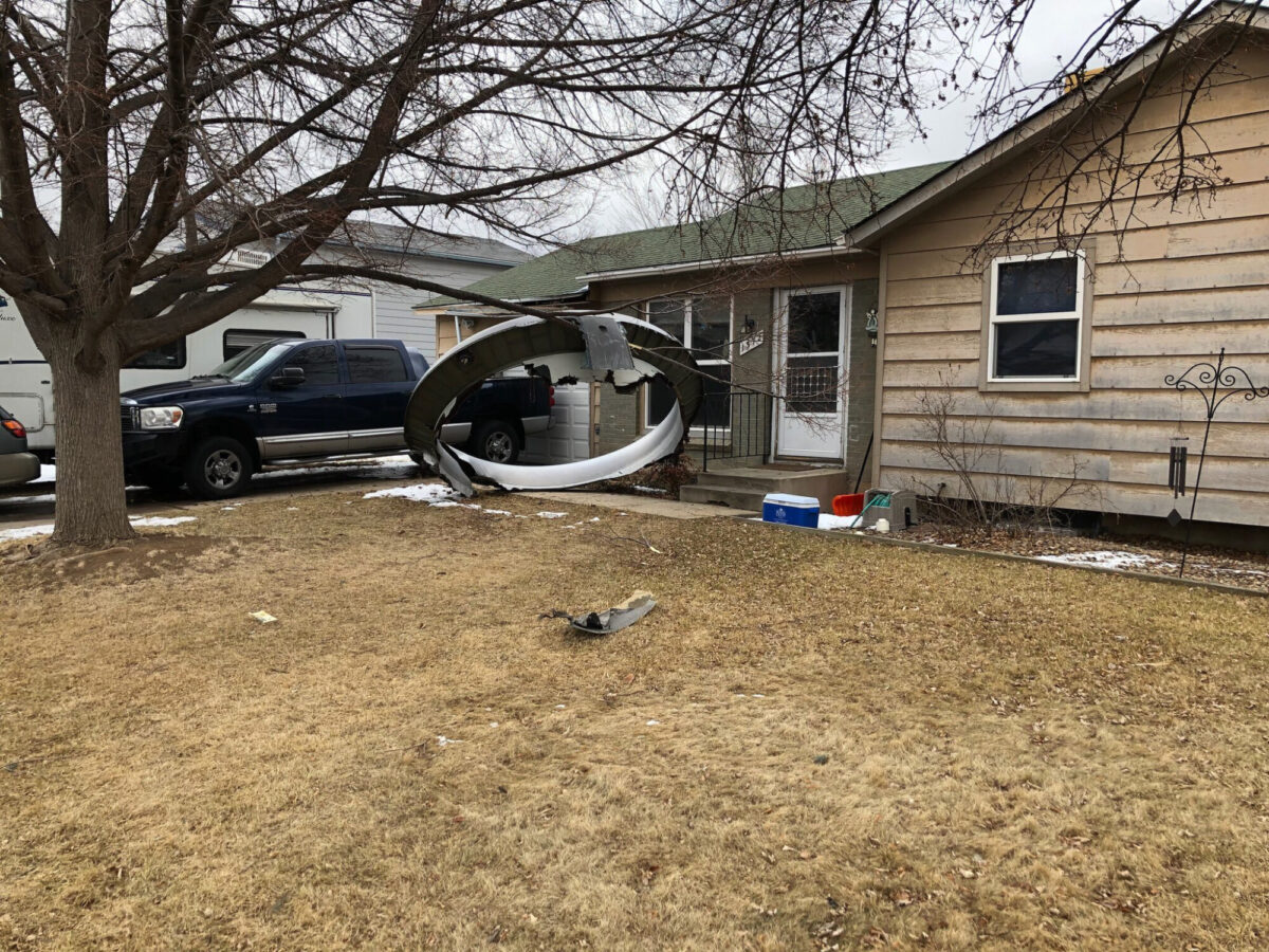 Debris is scattered in the front yard of a house at near 13th and Elmwood, in Broomfield, Colo., on Feb. 20, 2021. (Broomfield Police Department via AP)