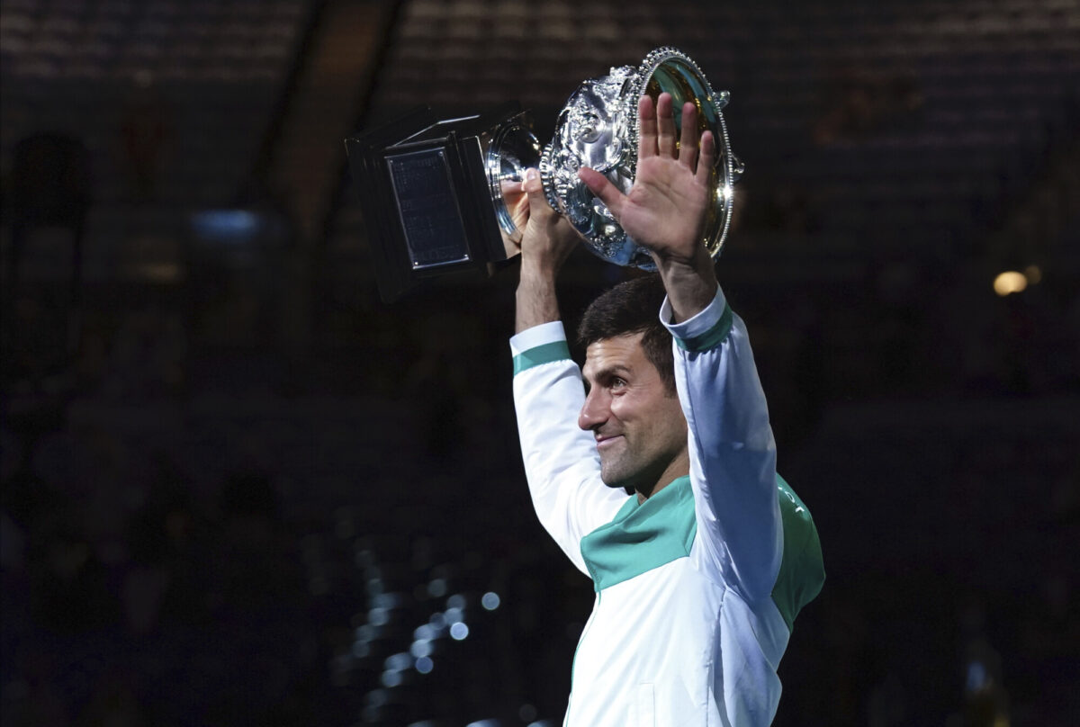Serbia's Novak Djokovic holds the Norman Brookes Challenge Cup aloft after defeating Russia's Daniil Medvedev in the men’s singles final at the Australian Open tennis championship in Melbourne, Australia, on Feb. 21, 2021. (Mark Dadswell/AP Photo)