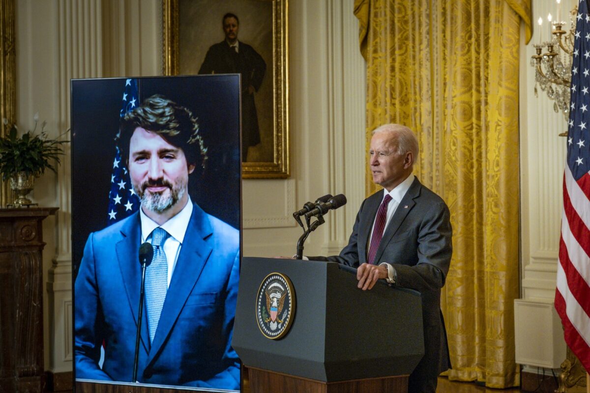 President Joe Biden and Canadian Prime Minister Justin Trudeau deliver opening statements via video link in the East Room of the White House in Washington, on Feb. 23, 2021. (Pete Marovich-Pool/Getty Images)