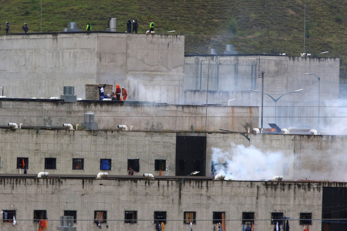Tear gas rises from parts of Turi jail where an inmate riot broke out in Cuenca, Ecuador, on Feb. 23, 2021. (Marcelo Suquilanda/AP Photo)