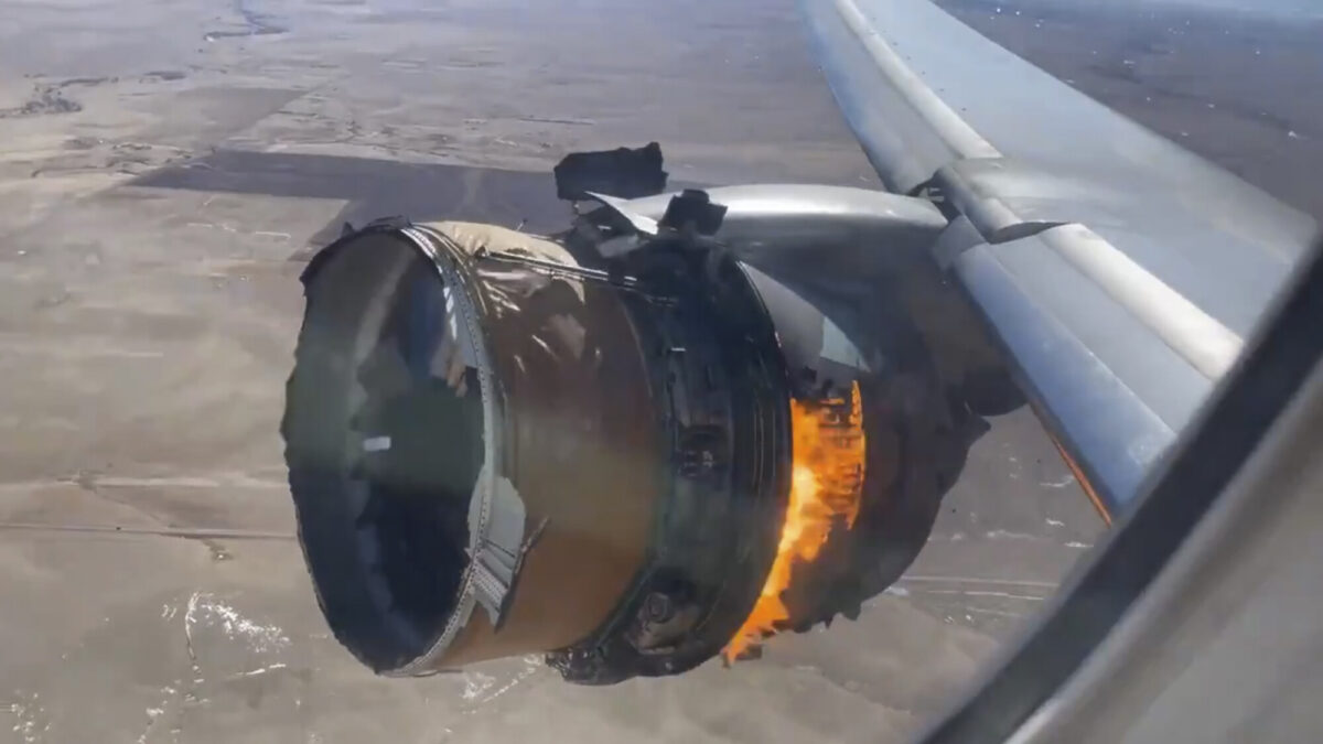 The engine of United Airlines Flight 328 is on fire after experiencing a "right-engine failure" shortly after takeoff from Denver International Airport in Denver, Colo., on Feb. 20, 2021. (Chad Schnell via AP)