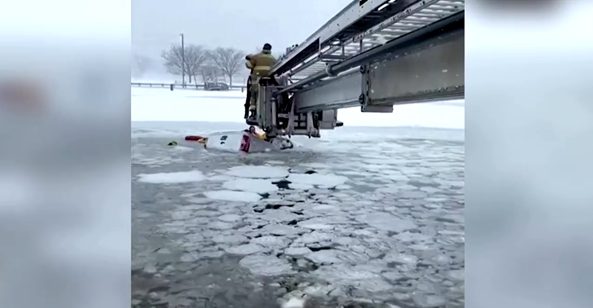 Rescuers Brave Cracking Ice to Pull Two From Sinking Truck