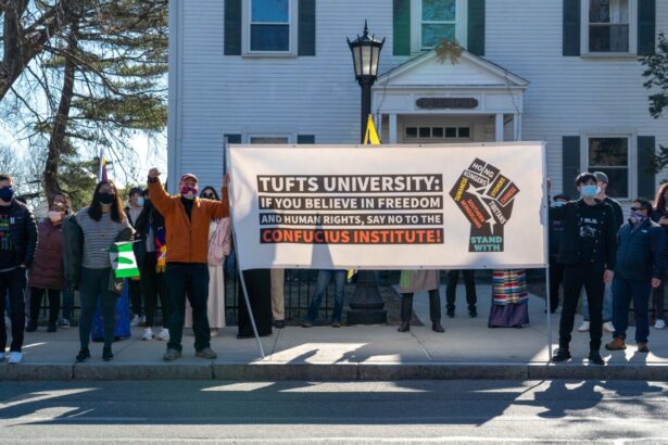 A human rights group urges Tufts University to close the Confucius Institute in Somerville, Massachusetts on March 13, 2021. (Learner Liu/The Epoch Times)