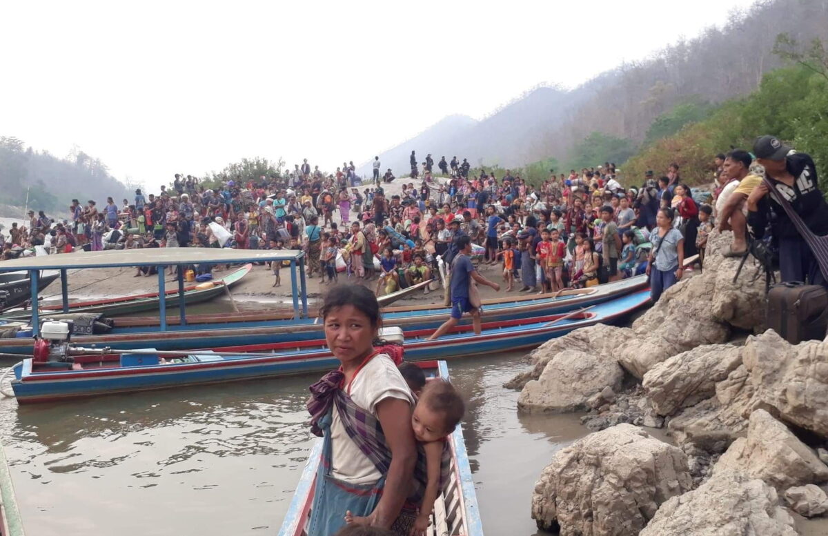 Karen refugees carrying belongings are seen at Salween riverbank in Mae Hong Son