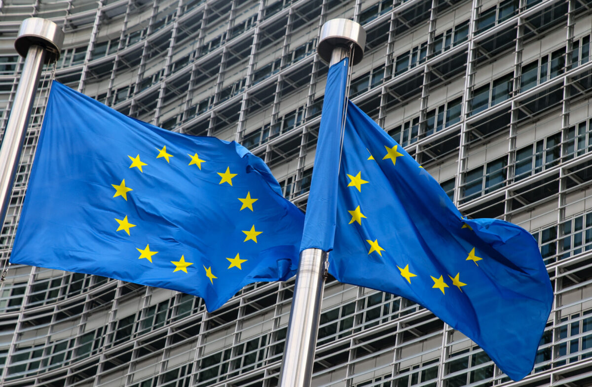 European Union flags fly outside the headquarters of the European Commission in Brussels on March 11, 2021. (Aris Oikonomou/AFP via Getty Images)
