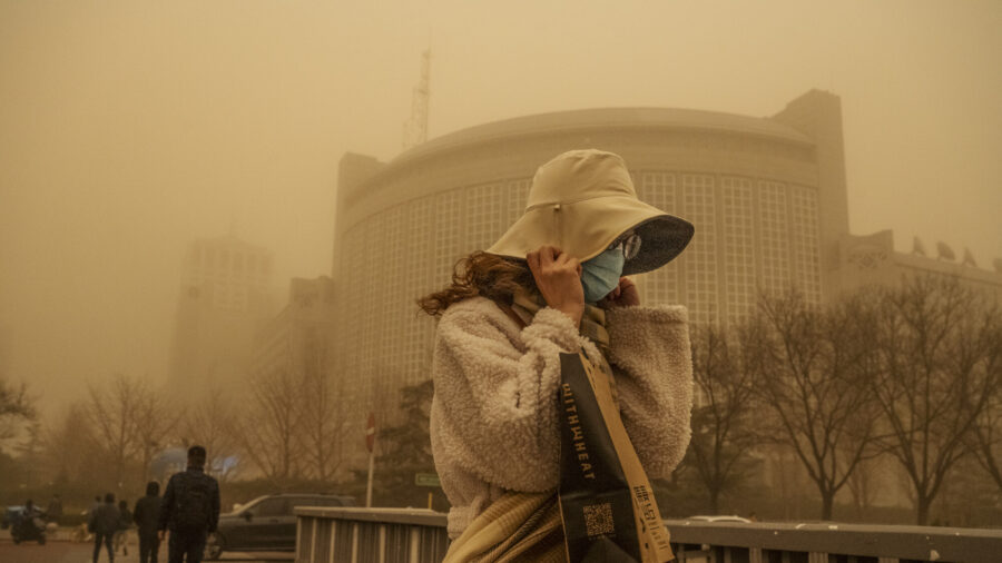 Chinese Tech Company Fined Over Fraud; Air Quality Suffers as Sandstorm Hits Beijing