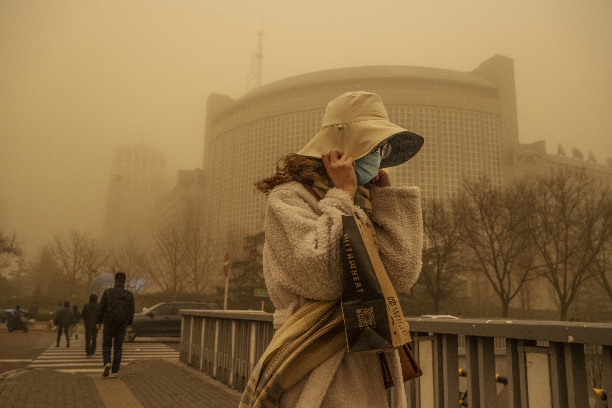 Chinese Tech Company Fined Over Fraud; Air Quality Suffers as Sandstorm Hits Beijing