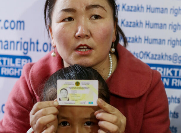 Gulzira Auelkhan, who spent close to two years trapped in China, speaks during an AFP interview at the office of the Ata Jurt rights group in Almaty, Kazakhstan, on Jan. 21, 2019. She is pictured with her 5-year-old daughter. (Ruslan Pryanikov/AFP via Getty Images)