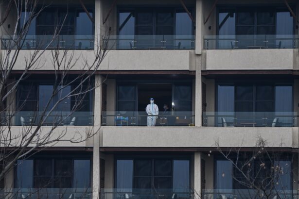 A health worker waits for members of the WHO