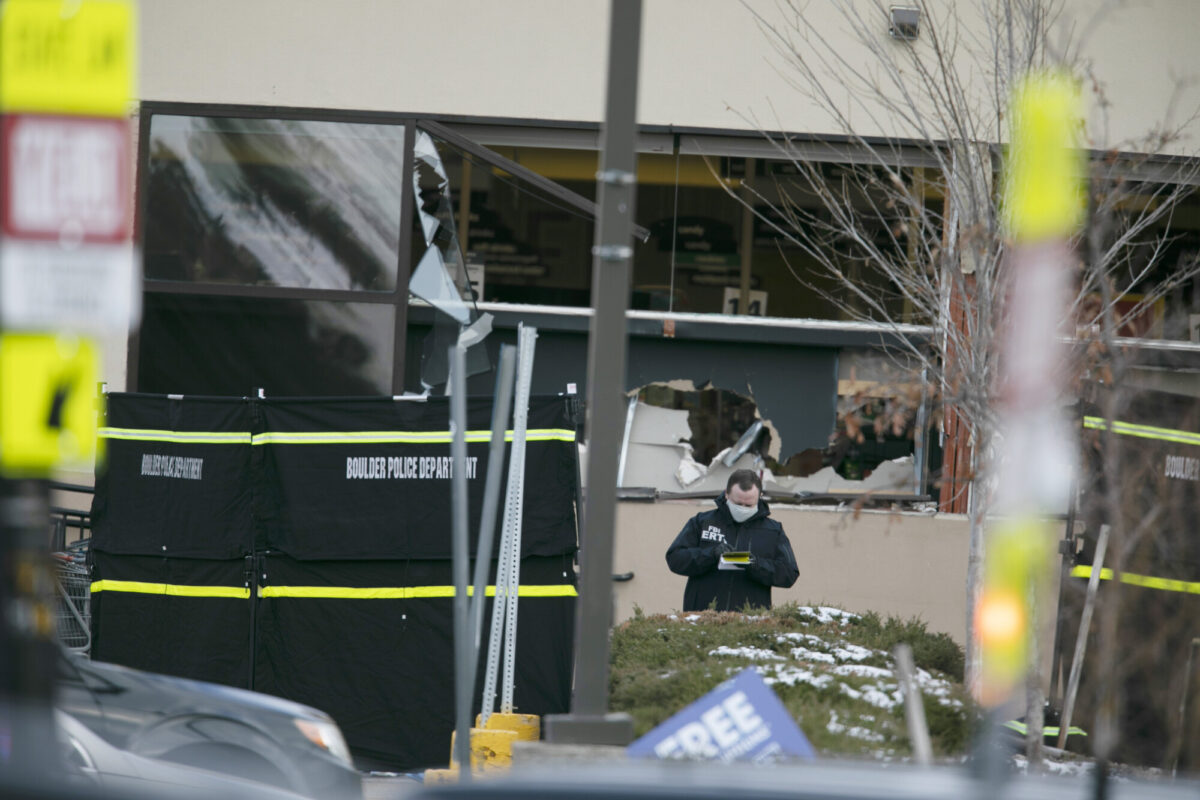 Police work on the scene outside of a King Soopers grocery store where authorities say multiple people were killed in a shooting in Boulder, Colo., on March 22, 2021. (Joe Mahoney/AP Photo)