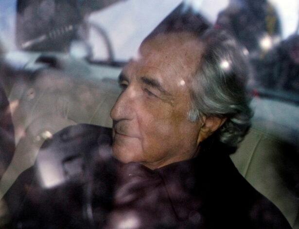 Bernard Madoff is escorted in a vehicle from Federal Court in New York City, on Jan. 5, 2009. (Lucas Jackson/Reuters)