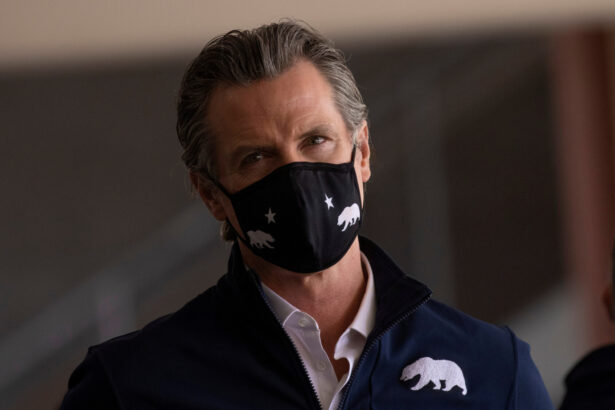 California Governor Gavin Newsom attends the opening of the country's first federal and state operated community vaccination site during the outbreak of the coronavirus disease (COVID-19) in Los Angeles, Calif., on Feb. 16, 2021. (Mike Blake/Reuters)