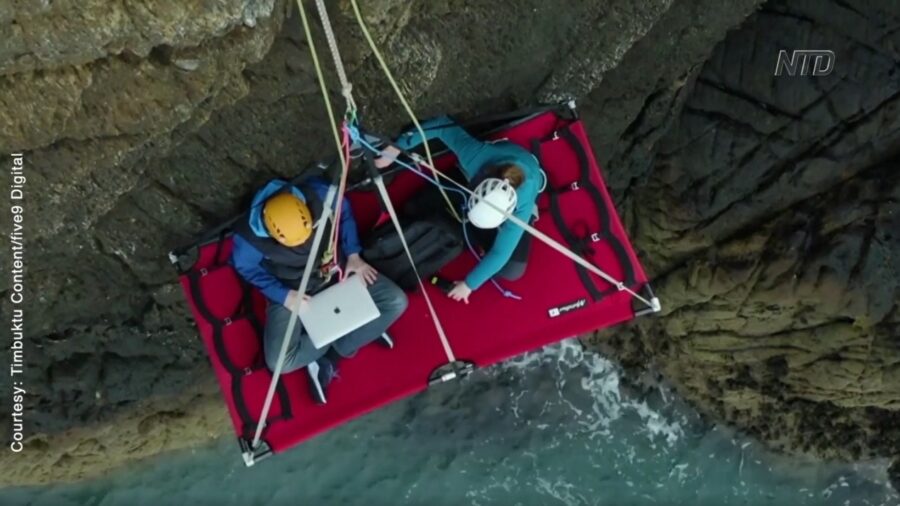 Remote Working While Hanging Off Cliff