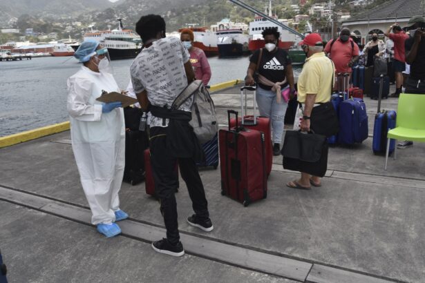 British, Canadian and U.S. nationals wait to board the Royal Caribbean cruise ship Reflection to be evacuated free of charge, in Kingstown on the eastern Caribbean island of St. Vincent, on April 16, 2021. (Orvil Samuel/AP Photo)