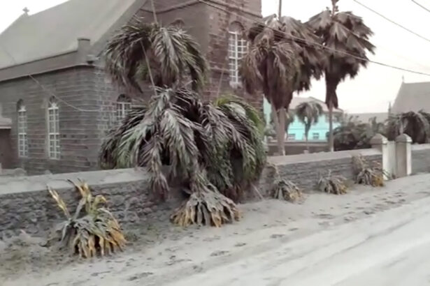 Ash covers palm trees and a church in a still image from video a day after the La Soufriere volcano erupted after decades of inactivity, about 5 miles (8 km) away in Georgetown, St Vincent and the Grenadines, on April 10, 2021. (Robertson S. Henry via Reuters)