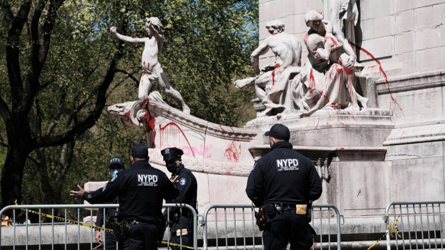 Protesters Desecrate National Monument