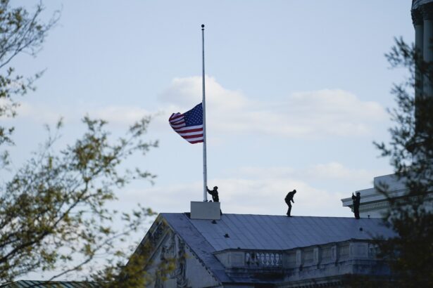 The American flag at the U.S. Capitol is lowered to half-staff in honor of Capitol Police officer William Evans who was killed after a man rammed a car into two officers at a barricade outside the U.S. Capitol in Washington on April 2, 2021. (Alex Brandon/ AP Photo)