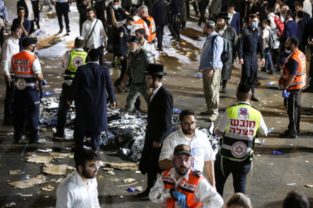 Medics and rescue workers attend to the Lag B'Omer event where fatalities were reported among the thousands of ultra-Orthodox Jews gathered at the tomb of a 2nd-century sage for annual commemorations that include all-night prayer and dance, at Mount Meron, Israel, on April 30, 2021. (Reuters)
