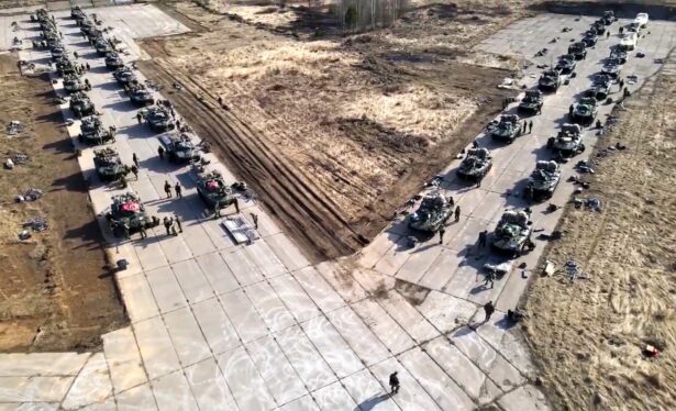 Russian military vehicles move during drills in Crimea, in a handout photo released on April 22, 2021. (Russian Defense Ministry Press Service via AP)