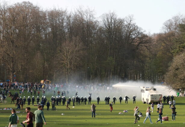 Belgian police forces disperse young people gathering at the Bois de la Cambre/Ter Kamerenbos park for a party in defiance of Belgium's social distancing measures and restrictions, in Brussels, Belgium, on April 1, 2021. (Clement Rossignol/Reuters)
