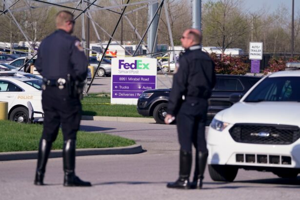 Police stand near the scene where multiple people were shot at the FedEx Ground facility in Indianapolis, Ind., early Friday morning, on April 16, 2021. (Michael Conroy/AP Photo)