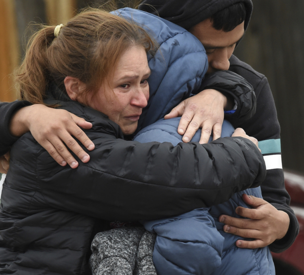 Family members mourn at the scene where their loved ones were killed in Colorado Springs, Colo., on May 9, 2021. (Jerilee Bennett/The Gazette via AP)