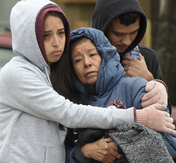 Family members mourn at the scene where their loved ones were killed in Colorado Springs, Colo., on May 9, 2021. (Jerilee Bennett/The Gazette via AP)