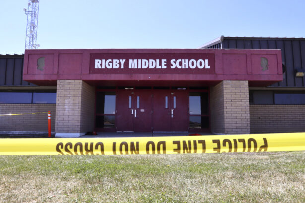 Police tape marks a line outside Rigby Middle School following a shooting there, in Rigby, Idaho, on May 6, 2021. (Natalie Behring/AP Photo)