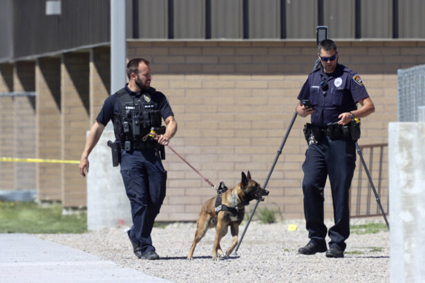 Police walk outside Rigby Middle School following a shooting there, in Rigby, Idaho, on May 6, 2021. (Natalie Behring/AP Photo)