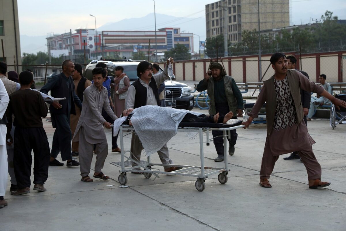 An injured school student is transported to a hospital after a bomb explosion near a school in west of Kabul, Afghanistan, on May 8, 2021. (Rahmat Gul/AP Photo)