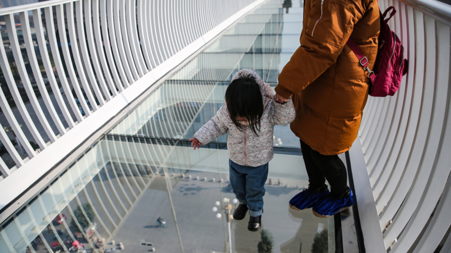 Wind Shatters Glass Bridge in China, Man Stranded