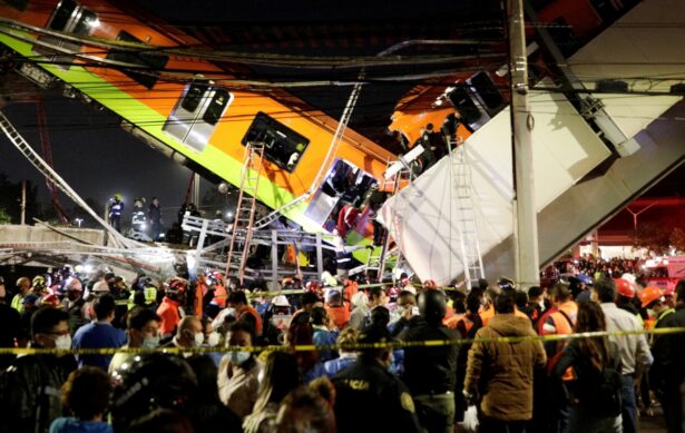 Rescuers work at a site where an overpass for a metro partially collapsed with train cars on it at Olivos station in Mexico City, Mexico on May 3, 2021. (Luis Cortes/Reuters)