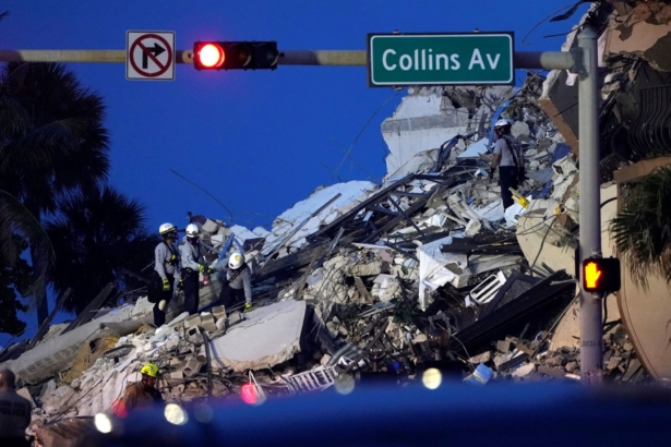 Rescue workers look through the rubble of a collapsed 12-story beachfront condo building on June 24, 2021, in the Surfside area of Miami, Fla. (Lynne Sladky/AP Photo)
