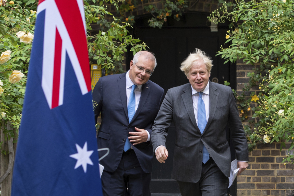 Britain's Prime Minister Boris Johnson (R) walks with Australian Prime Minister Scott Morrison after their meeting, in the garden of 10 Downing Street, in London, on June 15, 2021. (Dominic Lipinski/Pool via AP)