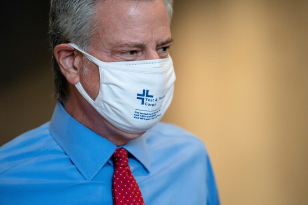 New York Mayor Bill de Blasio takes a facility tour before a ribbon-cutting ceremony to mark the opening of a Nanotronics manufacturing center at the Brooklyn Navy Yard, in the Brooklyn borough of New York City, on April 28, 2021. (John Minchillo/Pool via Reuters)