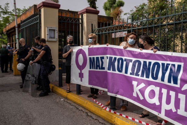 Protesters take part in a rally against domestic violence outside a court house where helicopter pilot Babis Anagnostopoulos is giving evidence after being charged with the murder of his British-Greek wife, in Athens, Greece, on June 22, 2021. (Petros Giannakouris/AP Photo)