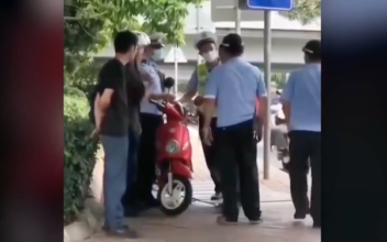 Outcry Over Chinese Police Slapping Biker