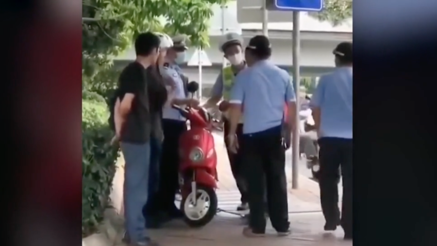 Outcry Over Chinese Police Slapping Biker