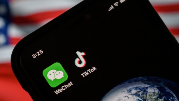 A mobile phone can be seen displaying the logos for Chinese apps WeChat and TikTok in Beijing, China, on Sept. 22, 2020. (Kevin Frayer/Getty Images)