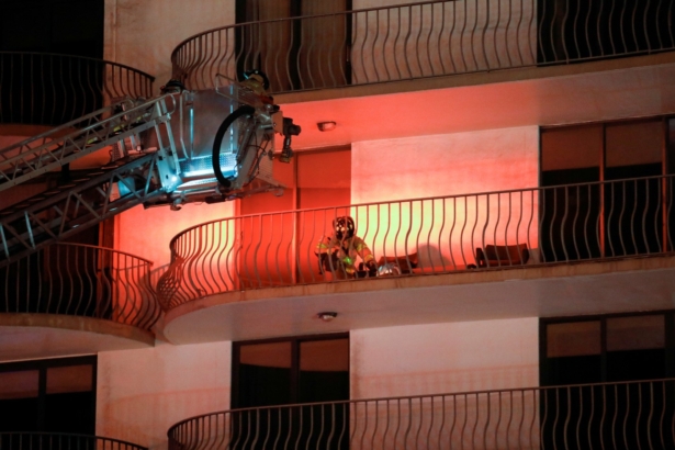 Emergency personnel work at the scene of a partial building collapse in Miami Beach, Fla., on June 24, 2021. (Marco Bello/Reuters)