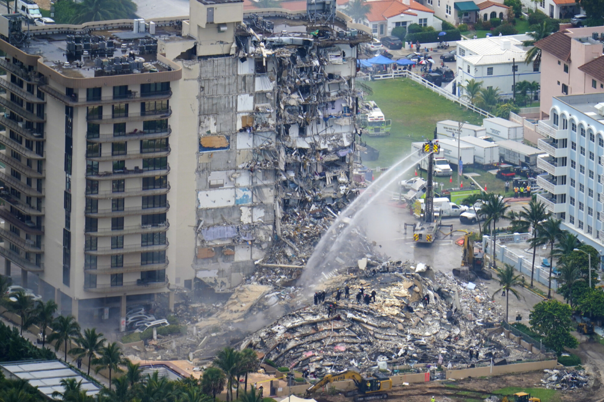 Rescue workers work in the rubble at the Champlain Towers South Condo in Surfside, Fla., on June 25, 2021. (Gerald Herbert/AP Photo)
